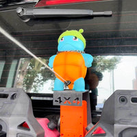 Figurine Pulvérisante Auto — Un Jet D’Eau Qui Fait Sourire